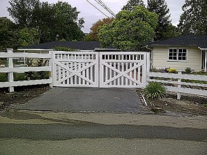 automatic driveway gate white wood
