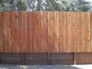 fence on retaining wall